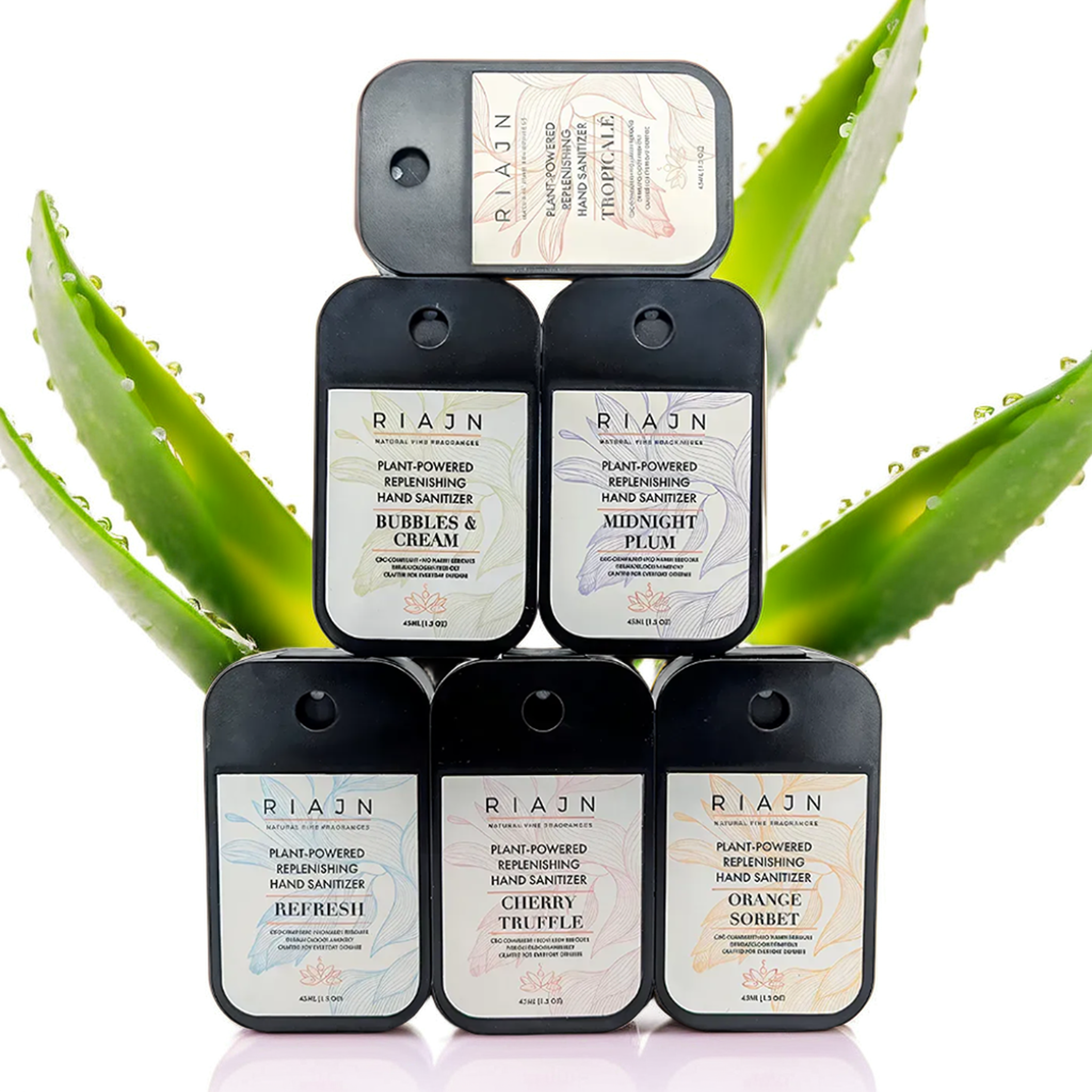 Stack of RIAJN hand sanitizer and cream products with aloe vera leaves in the background