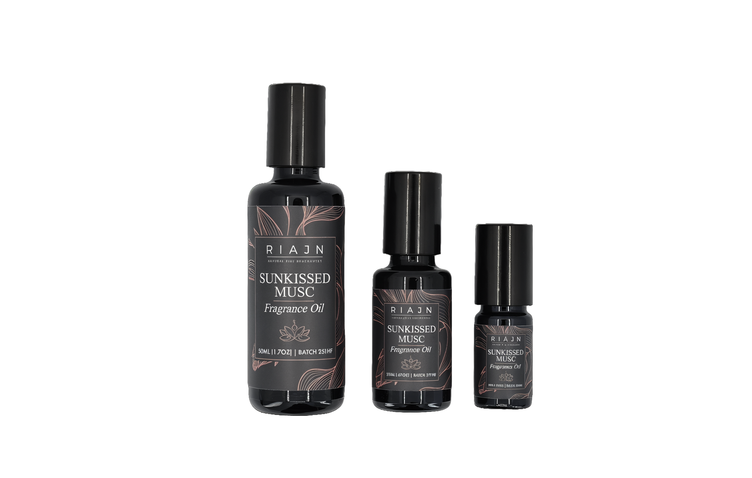 Three bottles of Riajen Sunkissed Musc scented perfume oil on a white background