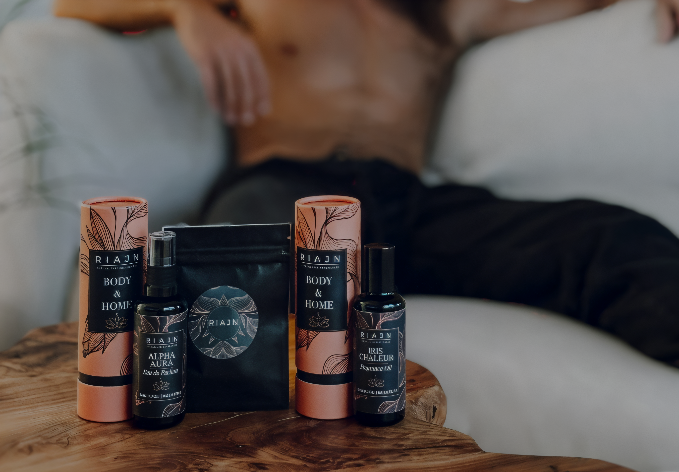 Three friends side-by-side with one arm wrapped around their friend and the other holding a color flow with various water color painting on the wall behind them 