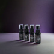 RIAJN Eau de Parfum Sample Set bottles standing on a grey floor with purple background with shadows. Top EDP sample sets. Top EDP fragrance sample set.