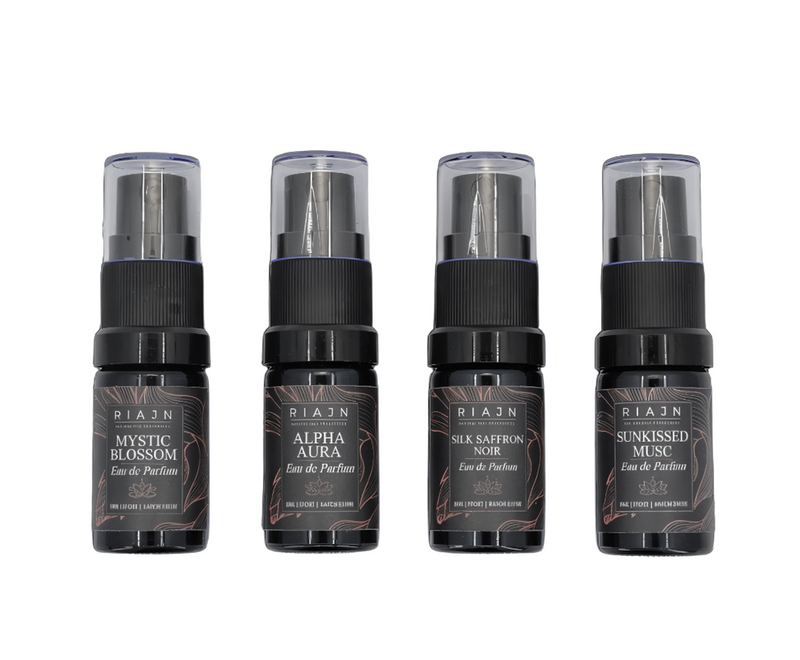 Four black perfume bottles with labels on a white background. RIAJN eau de parfum sample set.