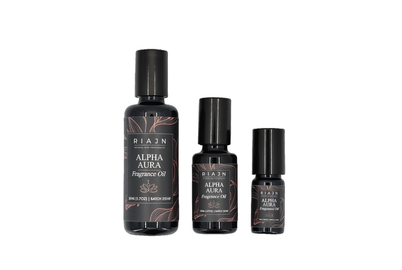 Three bottles of RIAN Alpha Aura essential oil perfume oil on a white background