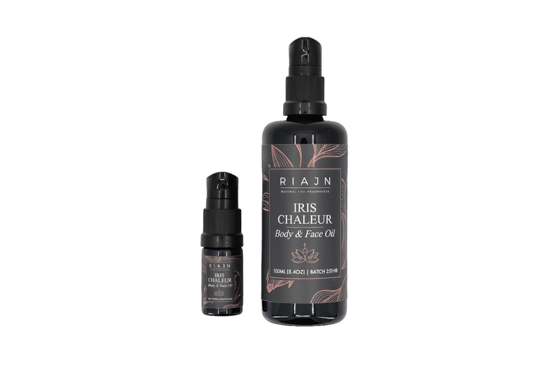Two bottles of Riaan Iris Chaleur Body & Face Oil on a white background