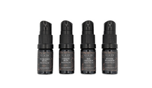 Four black spray bottles with labels on a white background. RIAJN body & face serum sample set.