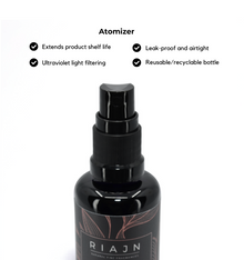 Black atomizer bottle with RIAJN branding on a white background, featuring product features.