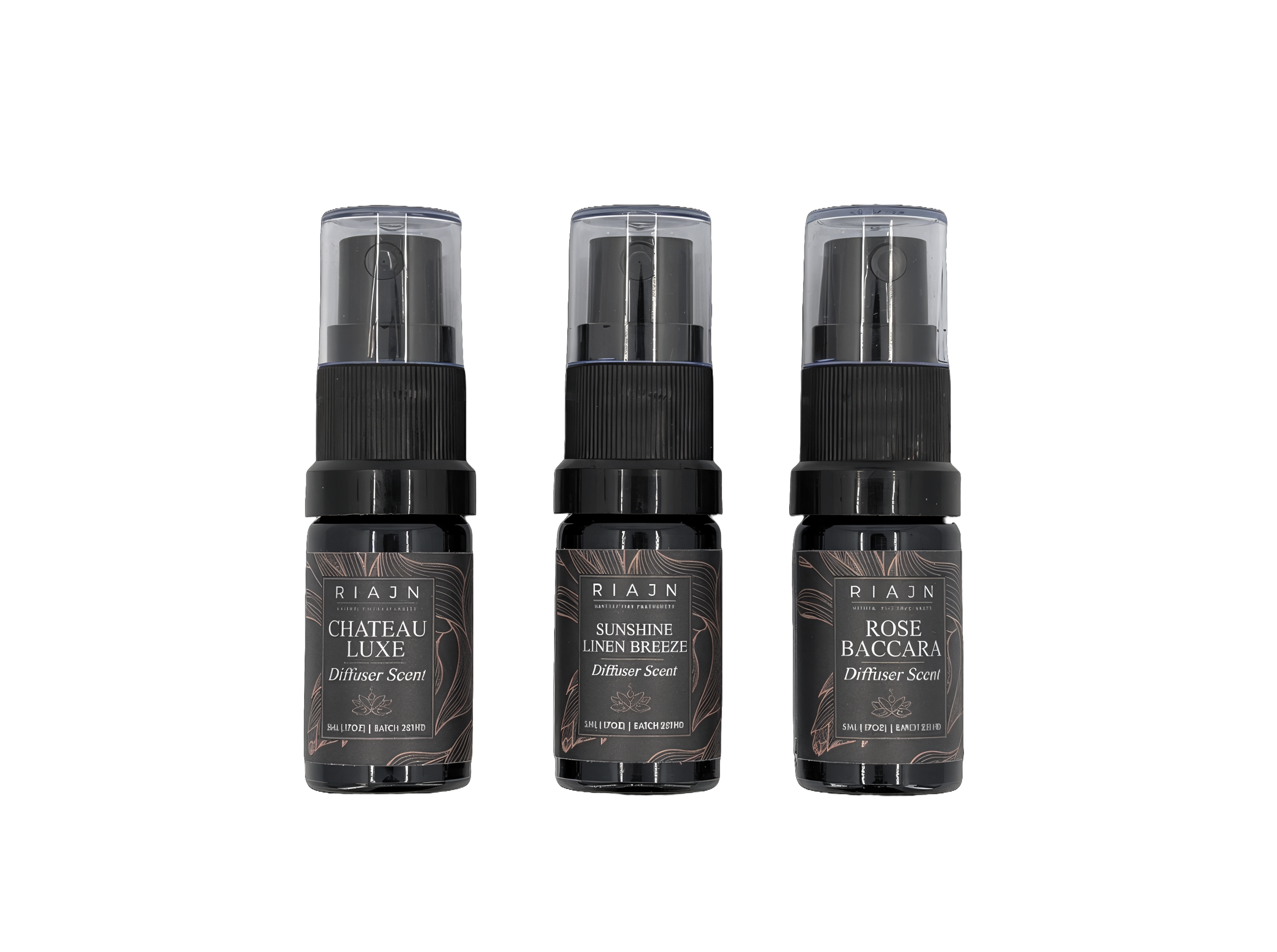 Three Riaan brand diffuser spray bottles on a white background