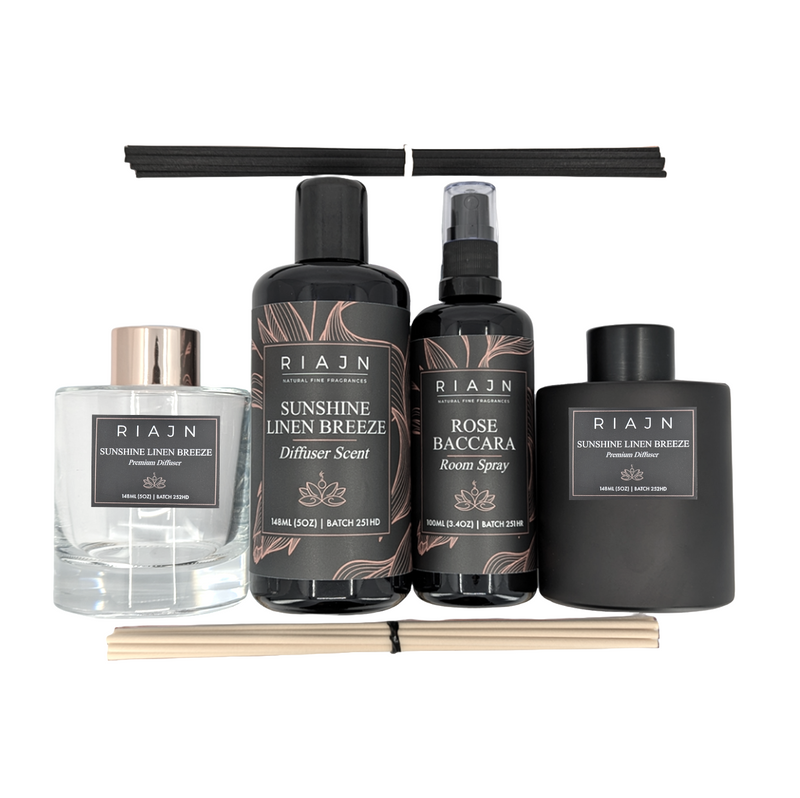 Set of RIAJN home fragrance products including diffuser, room spray, and diffuser bottles on a white background.