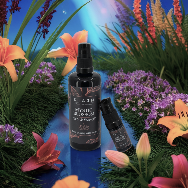 Riajn Mystic Blossom body and face oil bottle surrounded by colorful flowers on a blue gradient background