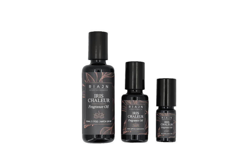 Three bottles of RIAJN Iris Chaleur Fragrance Oil on a white background