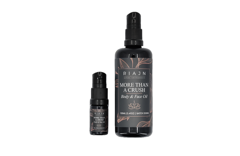Two bottles of RIAJN 'More than a Crush' body and face oil on a white background