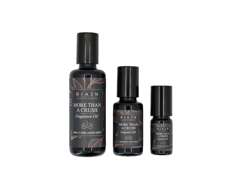 Three bottles of RIAIN More Than a Crush scented perfume oil on a white background