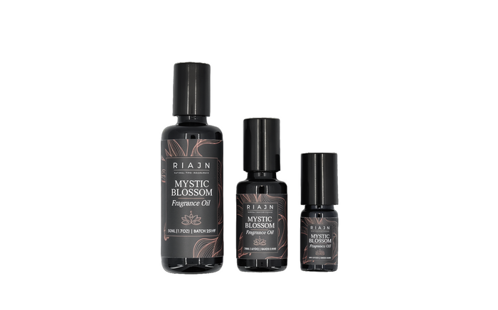 Three bottles of RIAJN Mystic Blossom Fragrance Oil on a white background