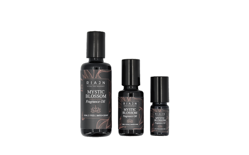 Three bottles of RIAJN Mystic Blossom Fragrance Oil on a white background