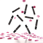Nine black 1 mL sample vials on a white background with pink rose petals falling from the sky and on the ground.