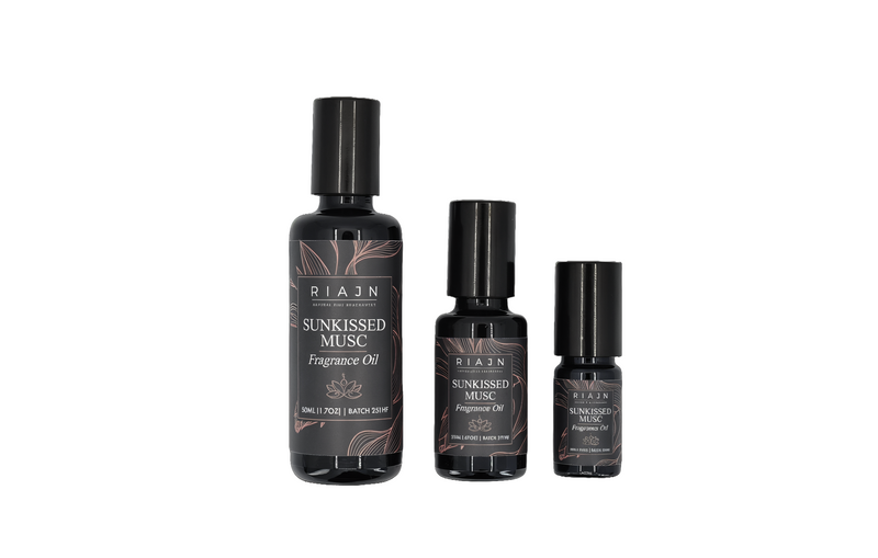 Three bottles of Riajen Sunkissed Musc scented perfume oil on a white background