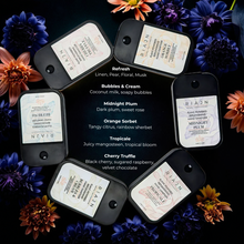 Collection of Rian product tags with scents on a dark background with flowers. Popular hand sanitizer mists.